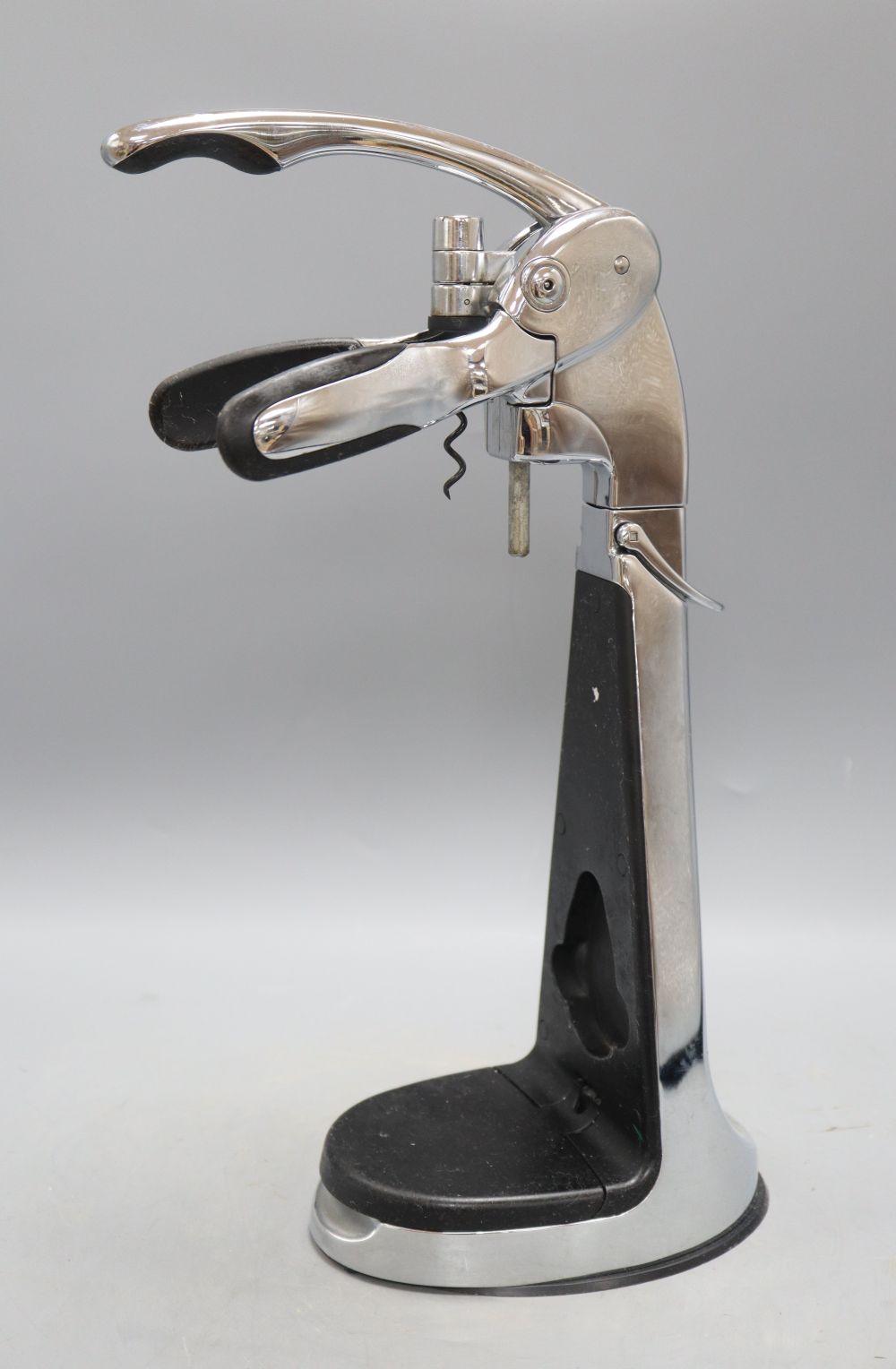 A table top bottle opener and corkscrew, height 39cm